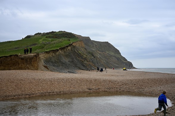 Picture of eroded coastline and beach taken at Seatown, Dorset UK. Part of the Jurassic Coast.