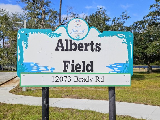 Signage for a big city park and baseball field, named Alberts Field.