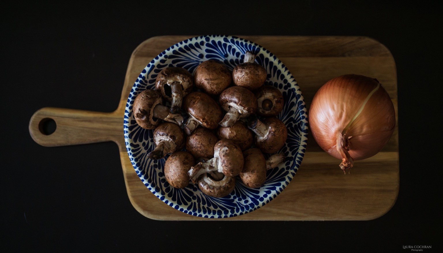  Flat lay view of mushrooms and an onion. 