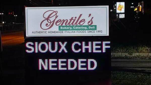 Restaurant sign advertising “SIOUX CHEF NEEDED.”